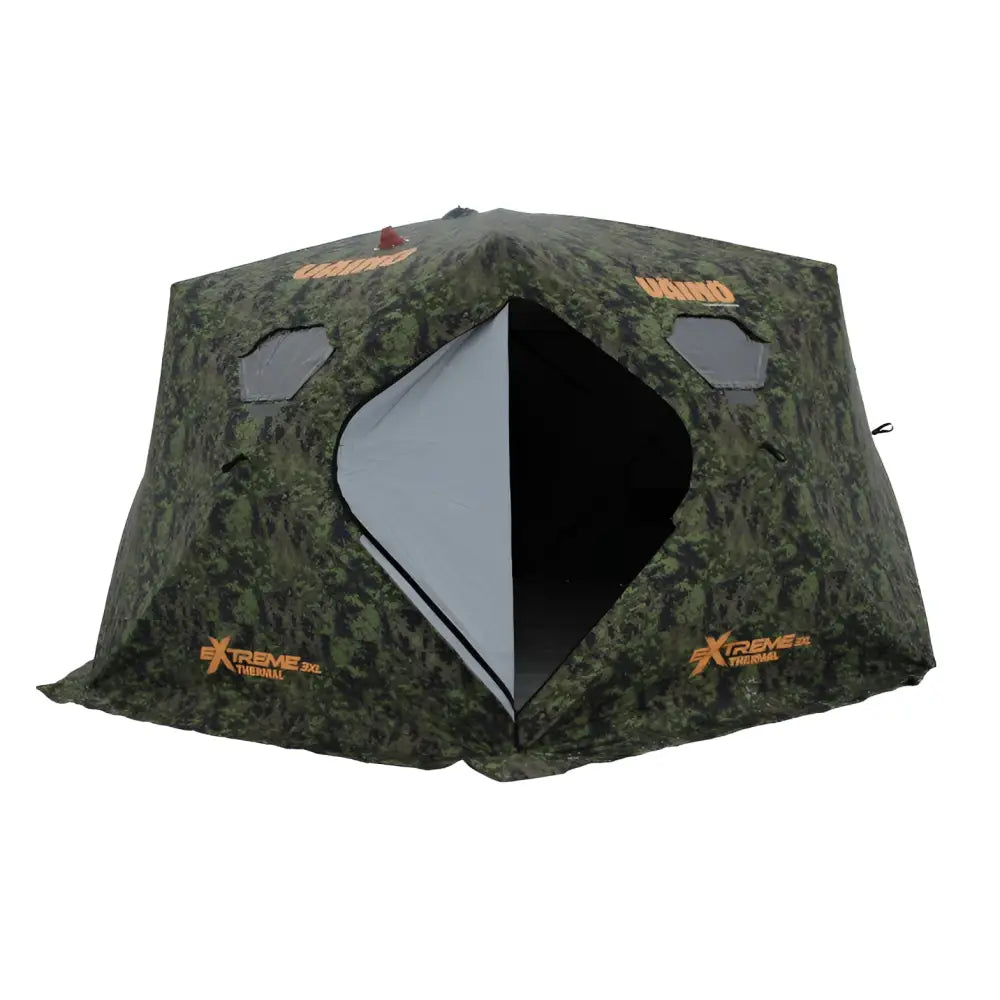 Väinö thermal extreme teltta xxxl camo kuosilla on camouflage-kuvioitu jääkalastusteltta oranssilla logolla ja timantinmuotoisella sisäänkäynnillä