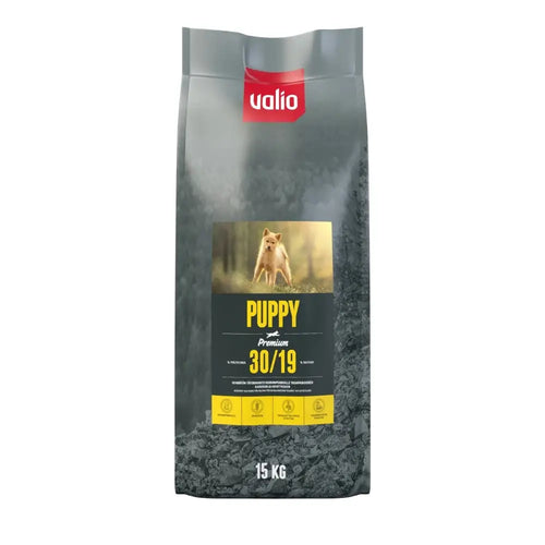 A 15 kg bag of valio puppy premium 30/19 dog food with silver and black packaging and a yellow label featuring a light-colored puppy