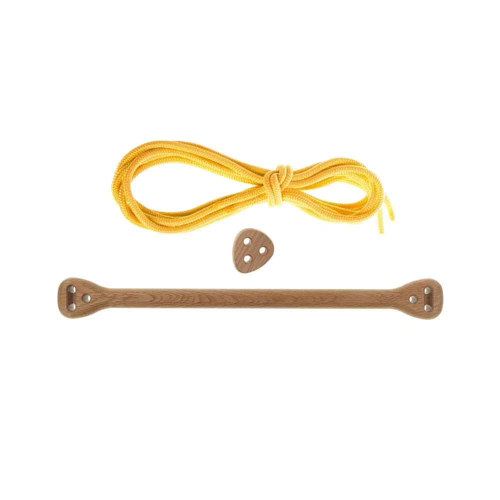 A wooden shoelace tie bone oak yellow with natural wood grain and metal eyelets paired with bright yellow braided lace
