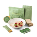 Granola muesli with raspberries breakfast food force in a white bowl garnished with fresh raspberries and mint