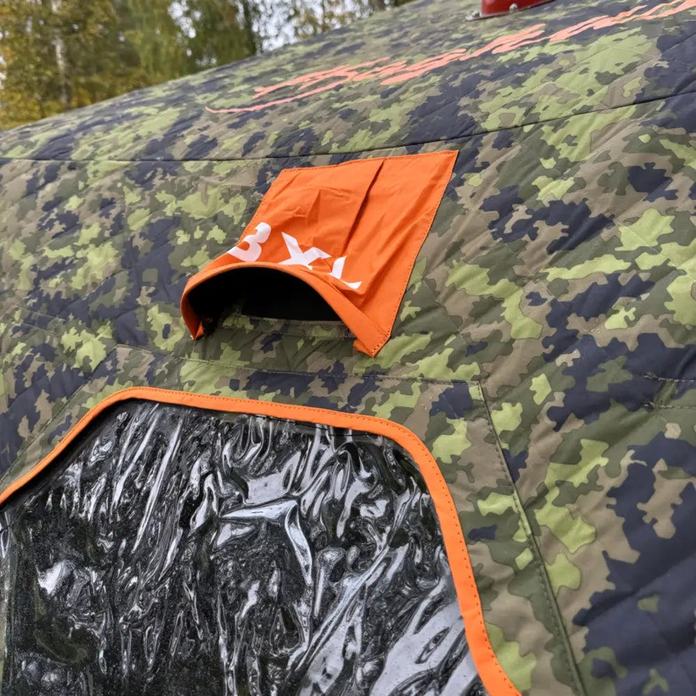 Haghus bushman 2xl metsästysteltta camouflage-kuosilla oranssilla reunuksella ja kirkkaalla muovikkunalla