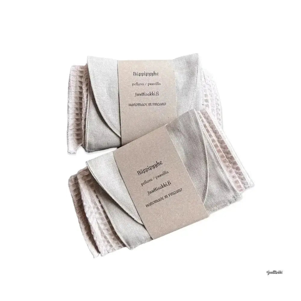 Beige värisiä waffle-kudottuja linen keittiöpyyhkeitä neatly folded and packaged with minimalistinen label from näppipyyhe collection