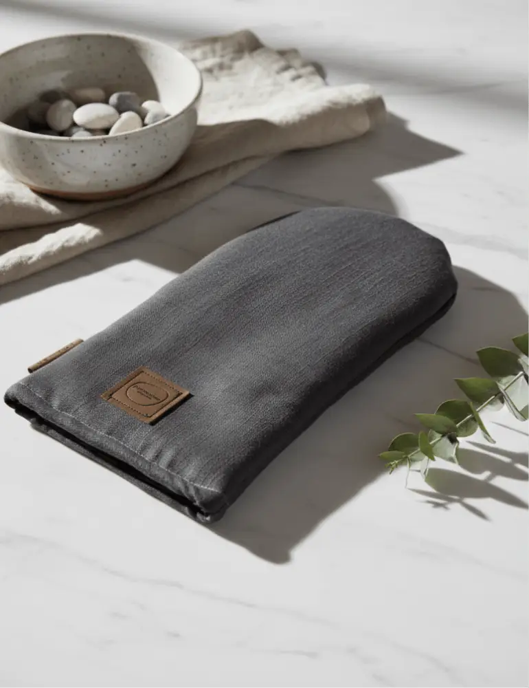 Dark gray fabric pouch patakinnas pellava with brown leather patch and zipper featuring minimalist design