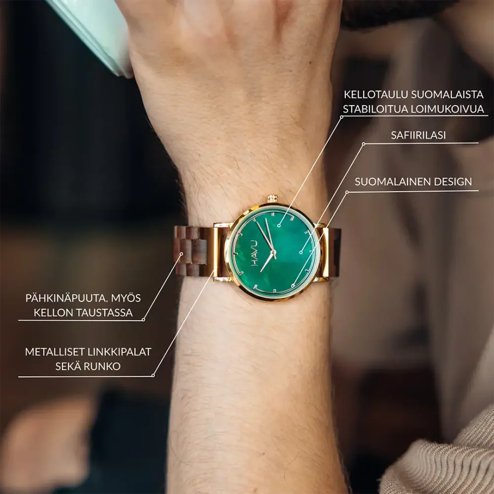 A green-faced revontuli pähkinäpuu 40mm watch with a gold-tone case and dark brown wooden band with minimalist markers