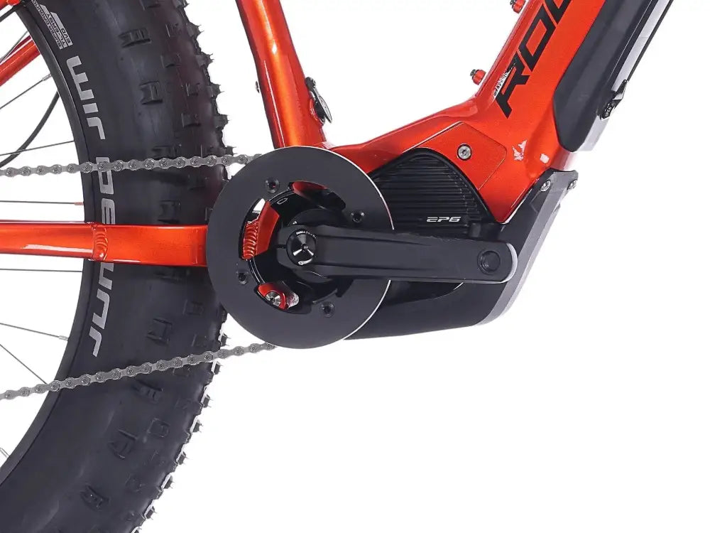 Rock Machine Vyöry E90 oranssi rovekypede sähkömoottorilla ja tukevalla ketjupyörällä takakuvassa