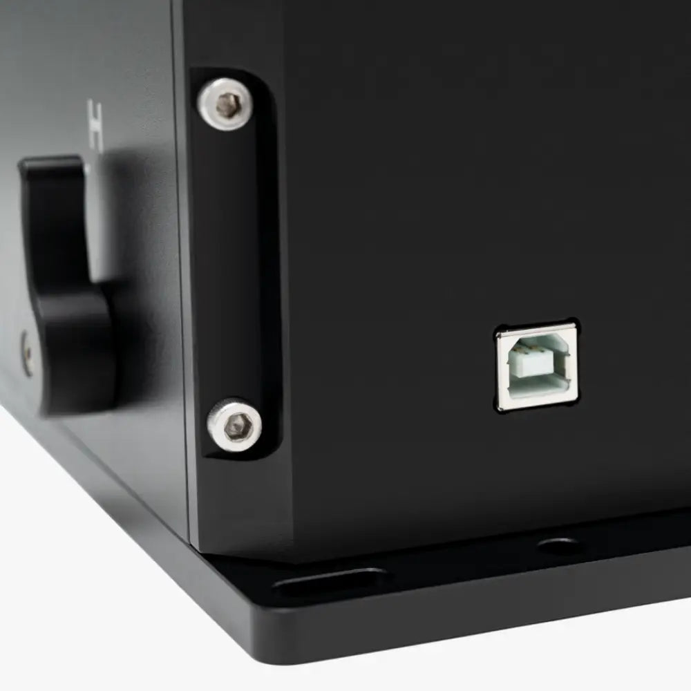 Black rectangular simagic ds-8x h pattern shifter showing back side with silver usb port and two side screws
