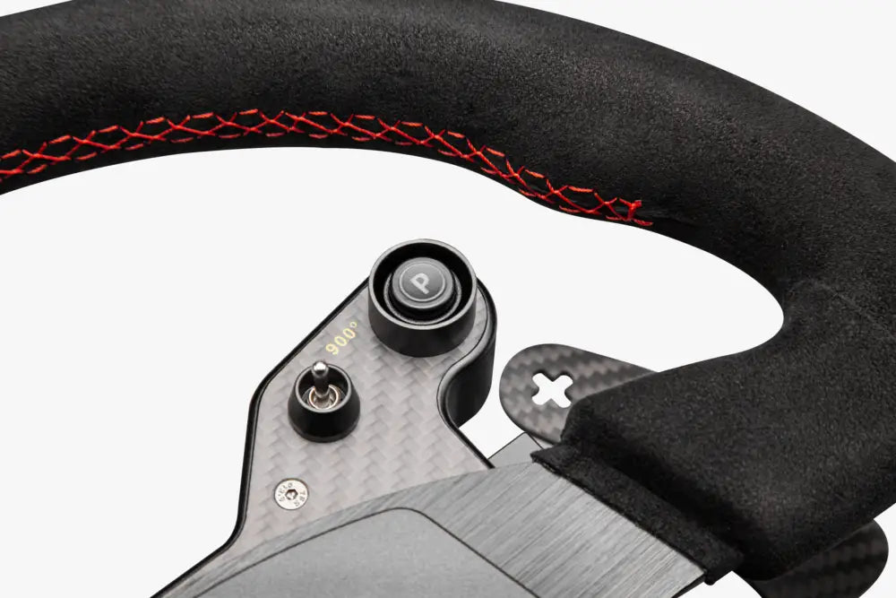 Simagic GT1 rounded steering wheel with black suede wrap, red stitching, and carbon fiber accents for racing use
