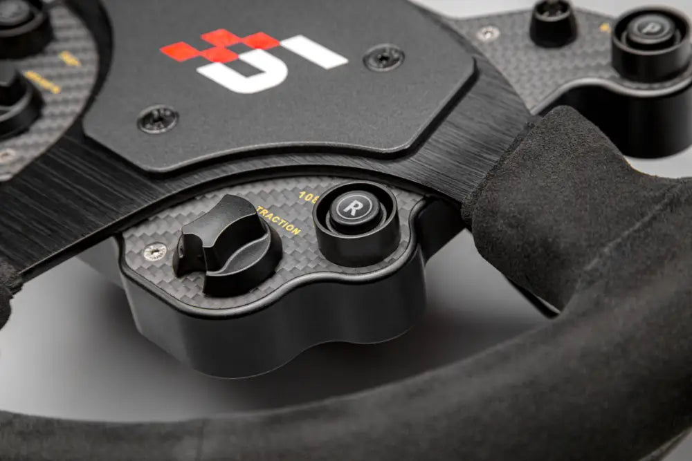 Simagic GT1 rounded steering wheel in black carbon fiber with textured grip and branded logo for racing use