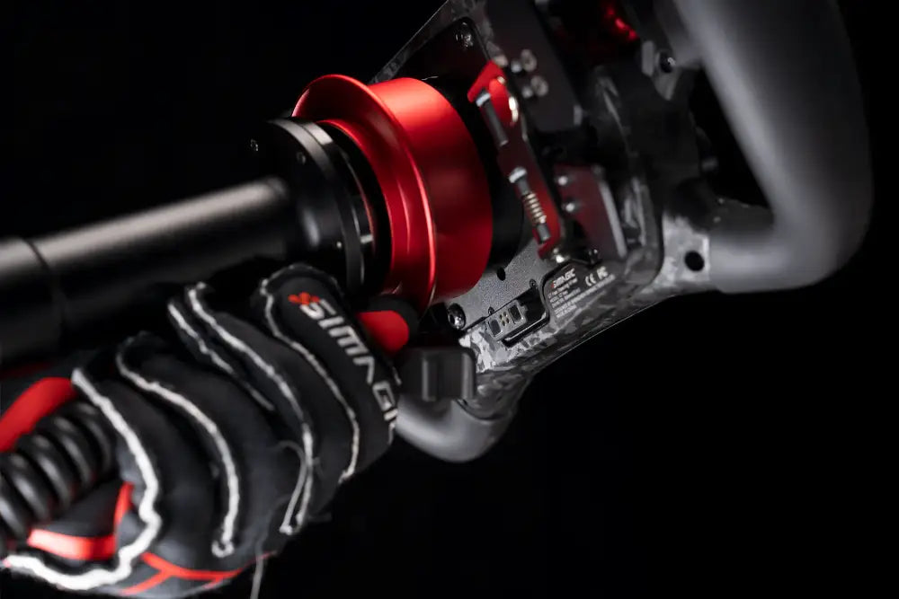 Black and red Simraceway racing steering wheel with carbon fiber accents for Simagic Maglink simulator setup