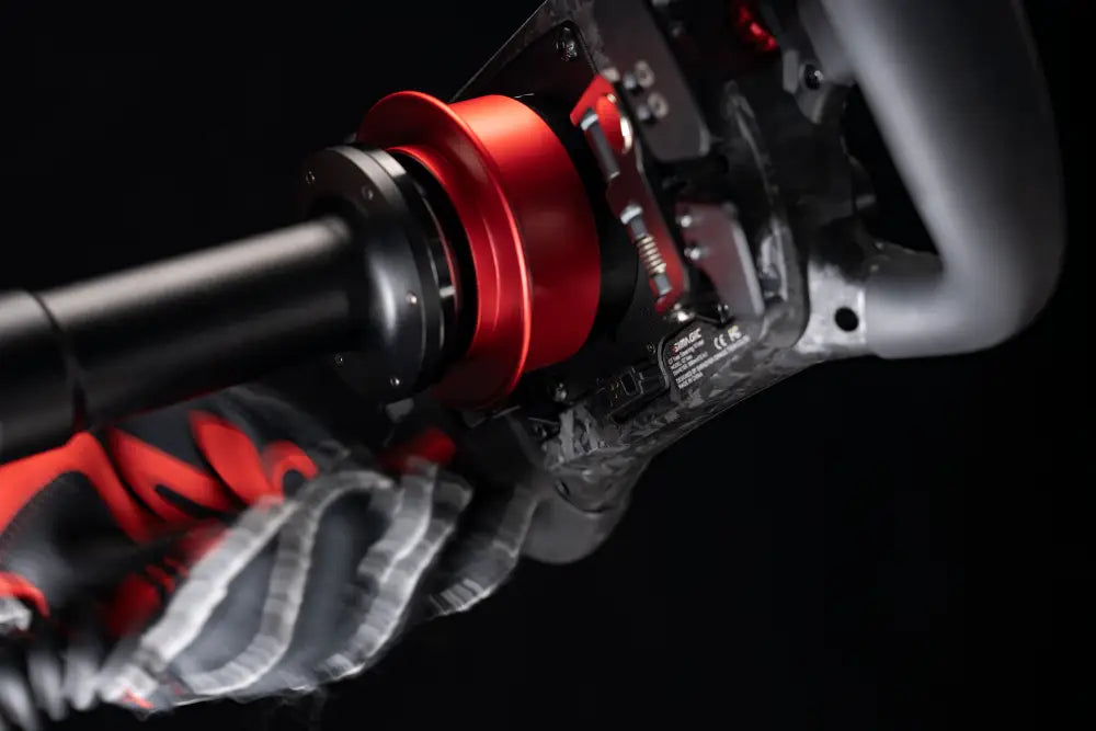 Red and black simagic maglink racing steering wheel with sleek high performance design for sim racing use