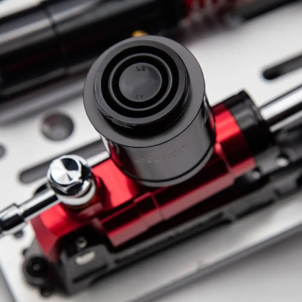 Red and black hydraulic brake caliper with polished chrome adjustment knob in simagic p2000 hydraulic 100kg 3-pedal set