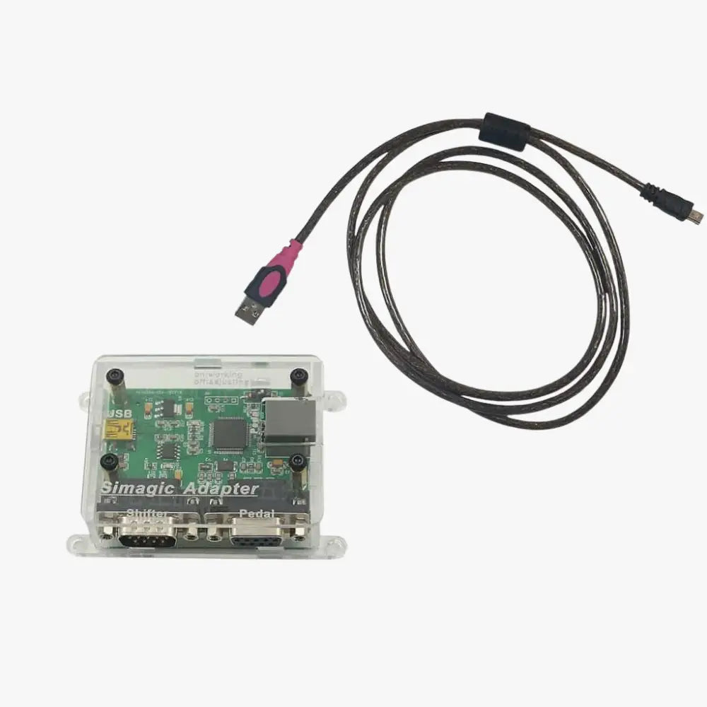 Clear plastic housing with green circuit board and black usb cable with pink connector of simagic peripheral adapter for thrustmaster and logitech