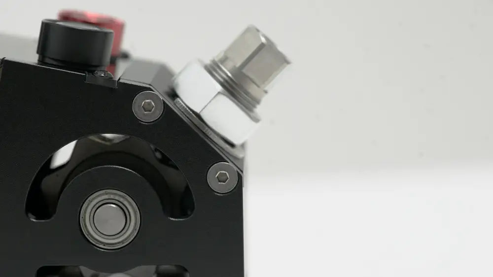 Black simagic q1 sequential shifter industrial pump with silver hexagonal nut and red button on top