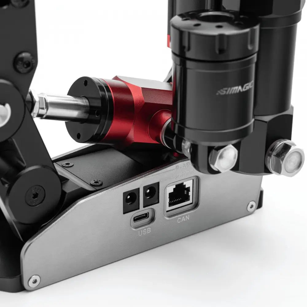 Simagic tb-rs hydraulinen käsijarru musta ja punainen simagro robottikäsivarsi metallisilla nivelillä ja hopeisella alustalla usb- ja can-portit takaa