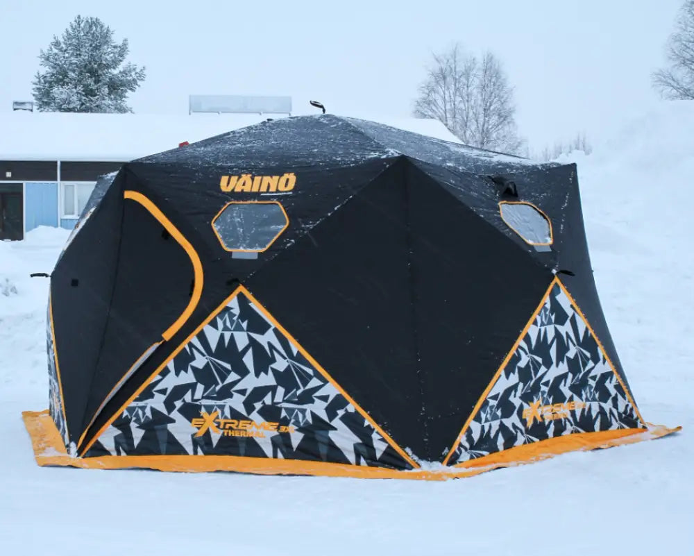 Mustan ja oranssin värinen väinö bunker thermal extreme xxxl pilkkiteltta geometrisellä kuviolla alaosassa