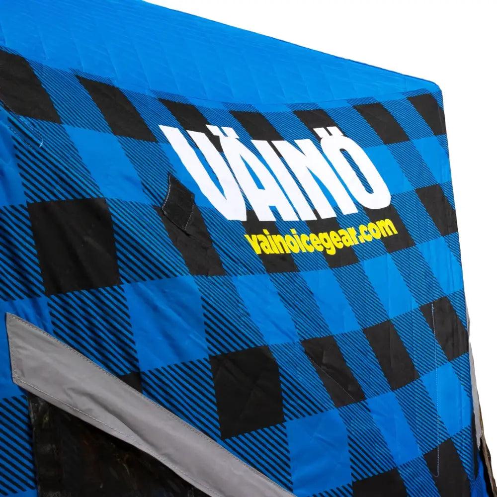 Blue and black plaid väinö ice lodge 600 pilkkiteltta cover with white and yellow branding for ice fishing use