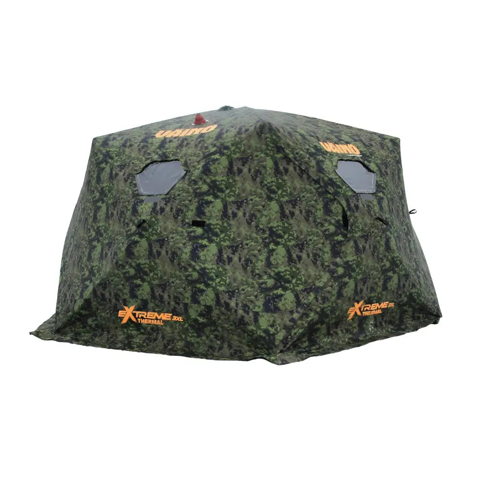 Vänö thermal extreme teltta XXXL camo-kuosilla on camouflage-kuvioitu united xtreme xl lämpökalastus teltta oranssilla brändäyksellä ja kuusikulmaisilla ikkunoilla