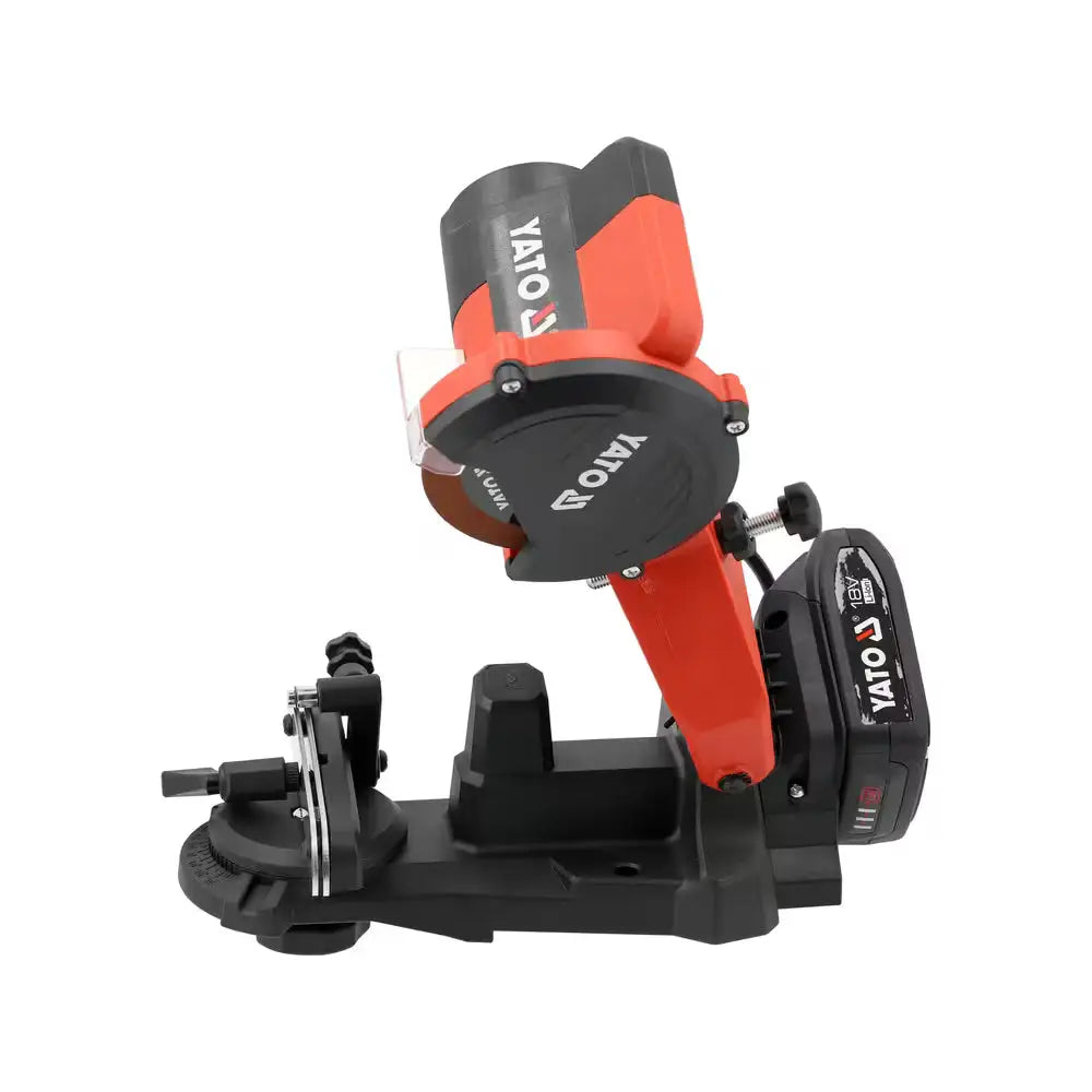 Red and black yato 18v cordless bench grinder with visible blade mounted on a sturdy base teräketjunteroitinsarja